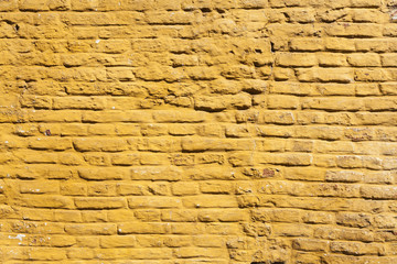 Wall Mural - square part of ochre yellow washed wall