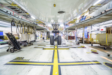 Wall Mural - Refurbishment of an airplane in a hangar.