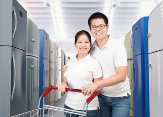 Wall Mural - asian couple shopping refrigerator