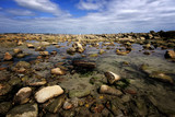 Fototapeta Fototapety z morzem do Twojej sypialni - Stones on the beach, Larmor Plage