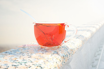 Wall Mural - Glass tea cup closeup