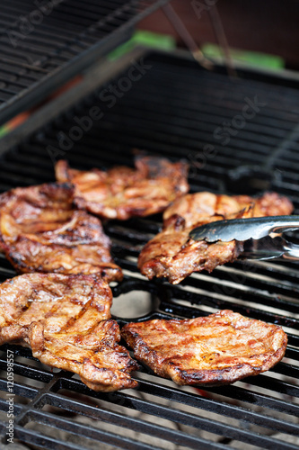 Fotografia, Obraz Grilled pork almost ready on the grill