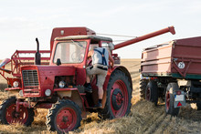 Farmer Adjusting Combine Trailer During Grain Harvest 