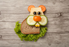 Hamster Made Of Bread And Vegetables On Desk