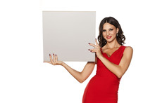 Young Beautiful Woman In A Long Red Dress Holding A Blank Board On A White Background