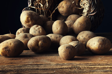 Potetoes on wooden table