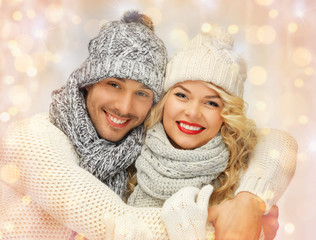 Poster - happy family couple in winter clothes hugging