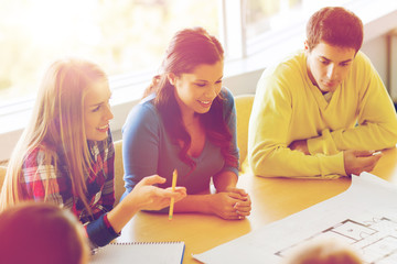 Wall Mural - group of smiling students with blueprint