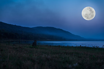 Wall Mural - mountain and river against blue sky and beautiful full moon at night