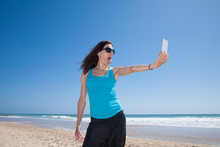 Woman Making Selfie Teasing At Beach