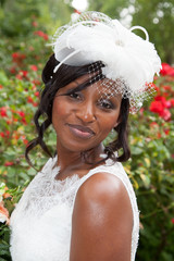 Wall Mural - Gorgeous african american bride outside posing and smiling
