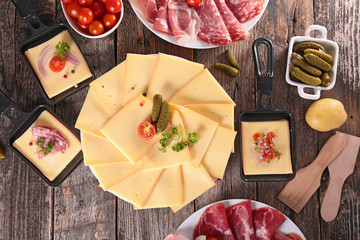 Wall Mural - raclette cheese and assorted salami