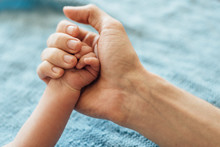 Dad Holding Baby Hand