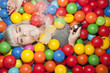 © HEX - Young woman in a ball pit