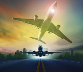 Canvas Print - passenger plane flying against skyscraper background for transpo