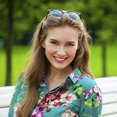 Wall Mural - Closeup portrait of a happy young woman smiling