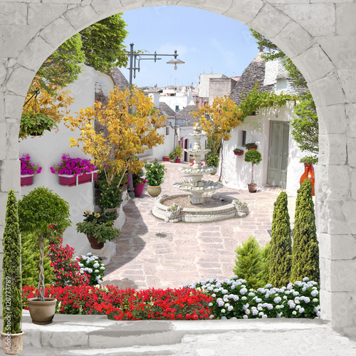 Dekoracja na wymiar  widok-na-ulice-z-kwiatami-i-fontanna-stare-miasto