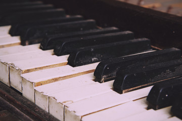 Wall Mural - Old broken disused piano with damaged keys Vintage Retro Filter.