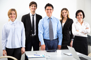 Wall Mural - Young businessman with colleagues