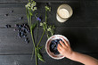 © Connect Images - Overhead view of boys hand picking up berries from bowl