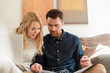 © Connect Images - Couple with laptop looking at paperwork