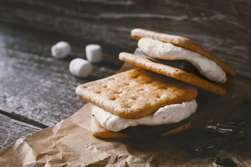 Wall Mural - Smores on the parchment  on the  wooden table