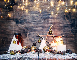 Wall Mural - Christmas home decoration.Wood craft rustic Xmas background with wooden letters standing in snow with a star and candle