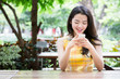 © Lodimup - Young asian woman happily using a smart phone