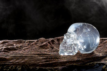 Creepy Crystal Skull With Smoke In A Dark Scary Setting