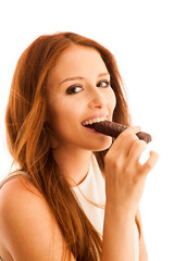 Wall Mural - woman eating chocolate bar isolated over white background