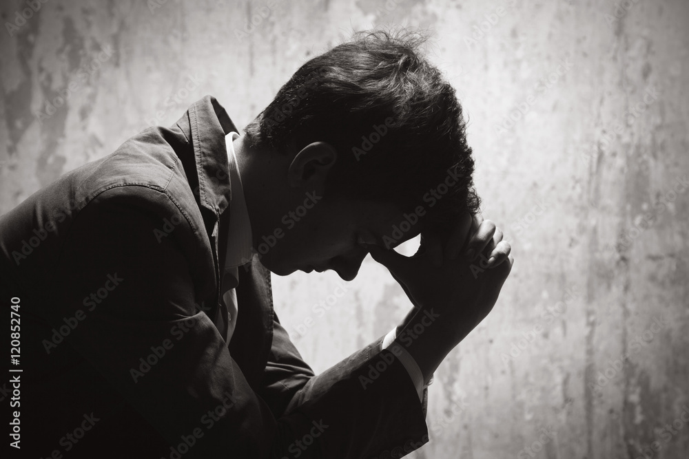 Young man in despair Stock Photo | Adobe Stock
