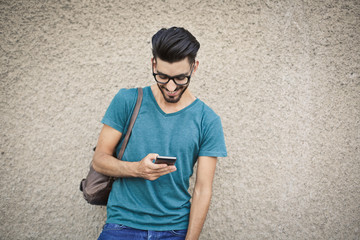 smiling man answering to a message