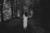 Fototapeta Paryż - Running woman in the forest