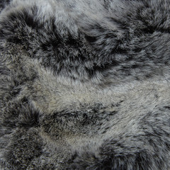 a full page of fluffy grey fake fur fabric background texture