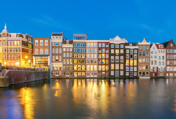 Wall Mural - Amsterdam. Night view of the houses along the canal.