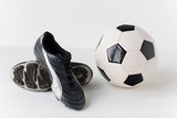 Fototapeta Sport - close up of soccer ball and football boots
