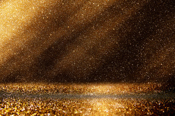 glitter vintage lights background. dark gold and black. defocuse