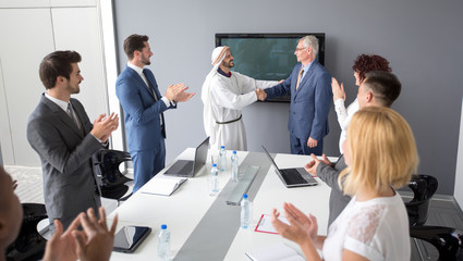 Canvas Print - Arabian partner and director of company handshake