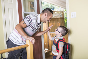 Cute 6 year old Caucasian boy inside home preschool