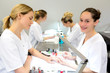 © Production Perig - Young attractive beautician students practising during courses