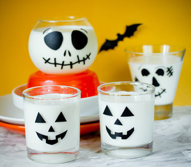 Wall Mural - Halloween cup with white dessert or drink