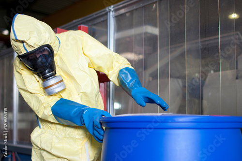 Fotografie, Obraz Workers in protective suits with toxic waste