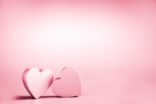 Two Pink Hearts On A Pink Background