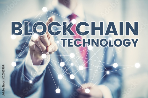 Blockchain technology concept, business man in suit selecting network interface.