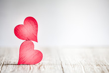 Two Red Hearts On Wooden Background