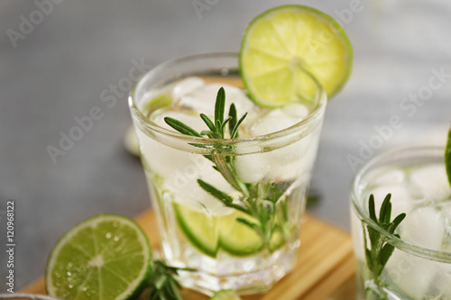 Fototapeta na drzwi i meble Cold fresh cocktail with lime on table