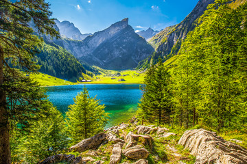 Tourquise clear Seealpsee with the Swiss Alps (mountain Santis) in the background, Appenzeller Land, Switzerland