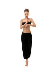 Studio photo of yoga instructor posing at camera