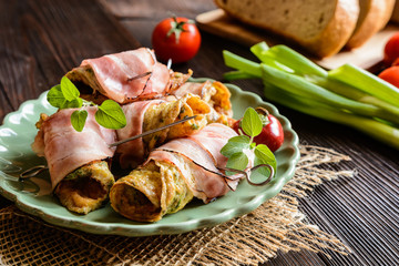 Wall Mural - Omelet rolls wrapped in smoked bacon slices