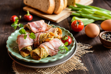 Wall Mural - Omelet rolls wrapped in smoked bacon slices